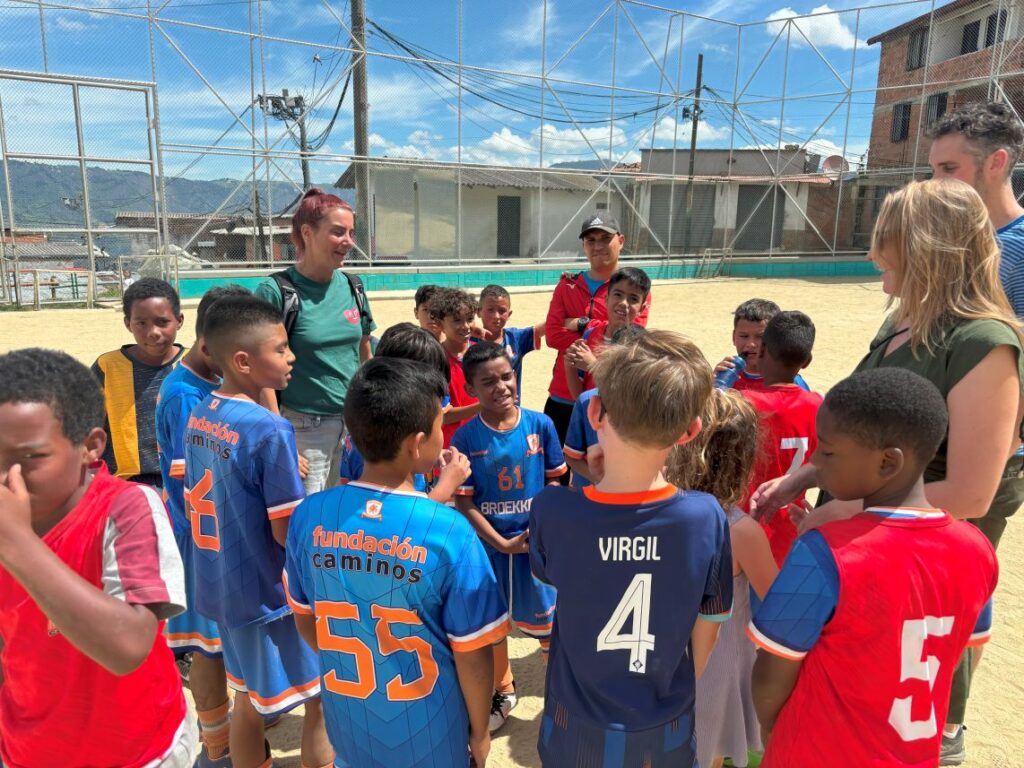 Play football with the local kids in a barrio